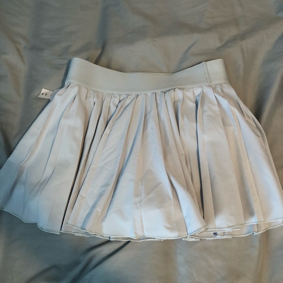 TNA Dresses & Skirts - TNA tennis skirt never worn, tags still on